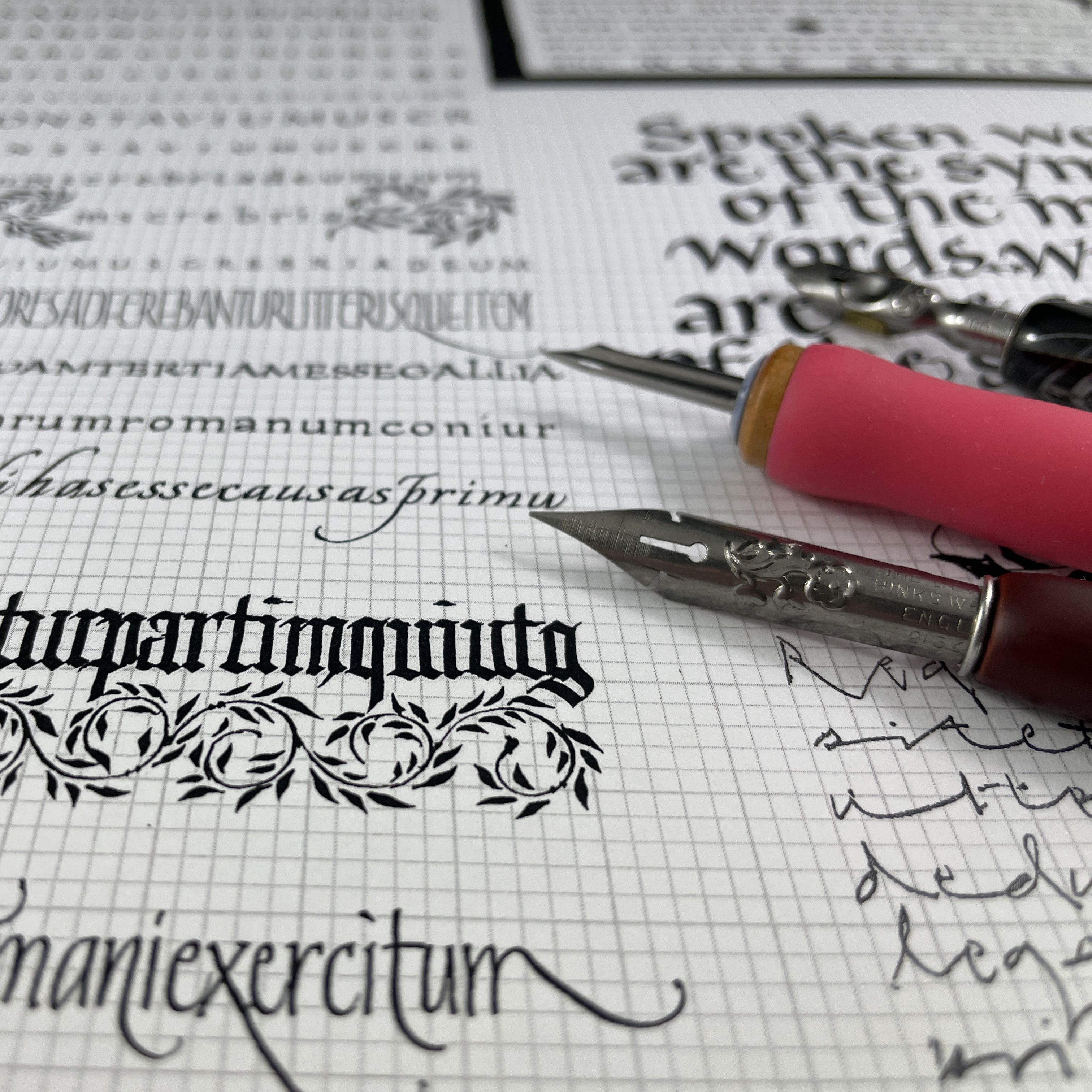 Close up of dip pens and hand drawn calligraphy