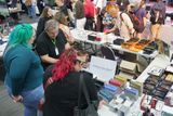 Two visitors look at the Melbourne Pen Depot table