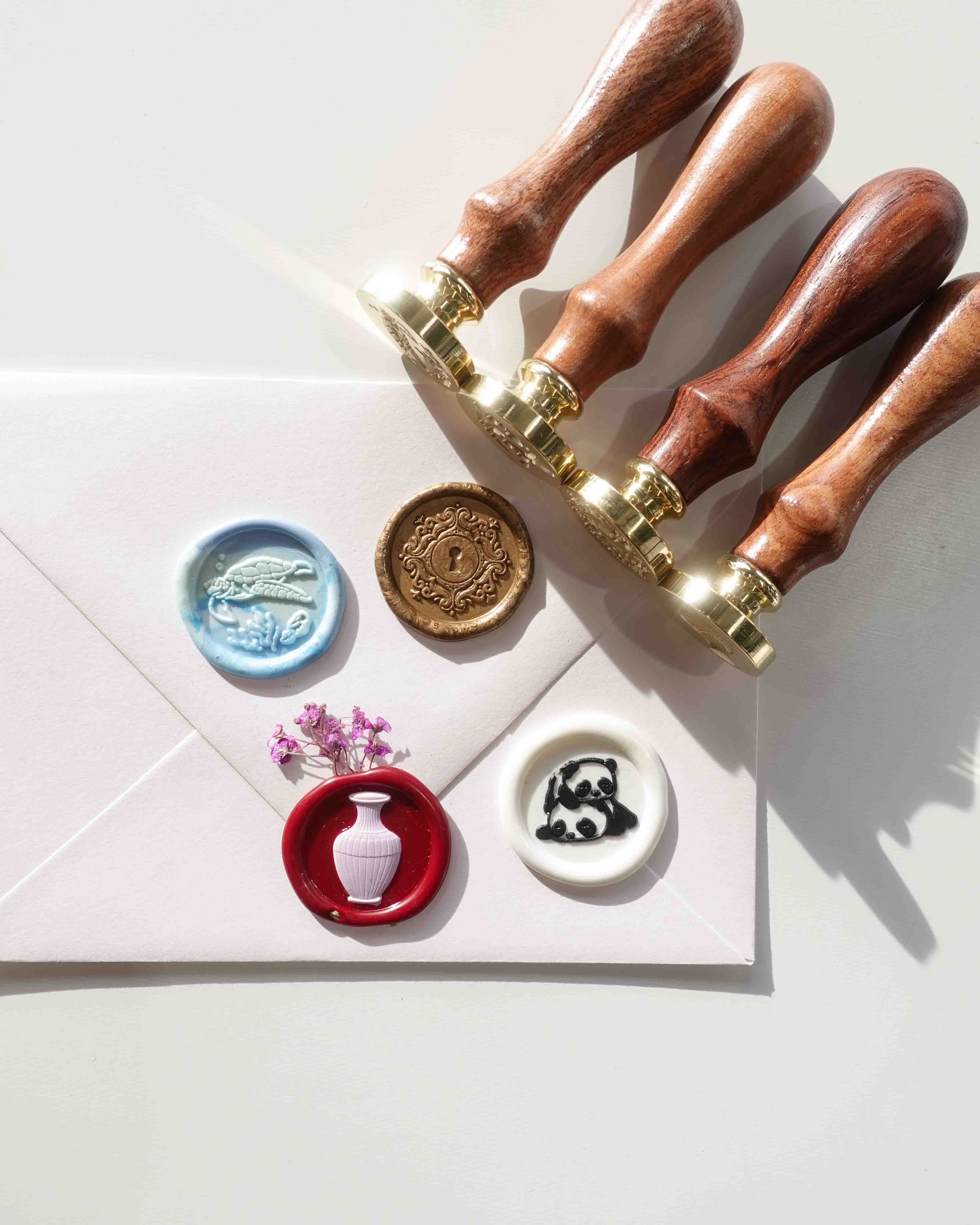 Four new stamps keyhole sea turtle vase panda