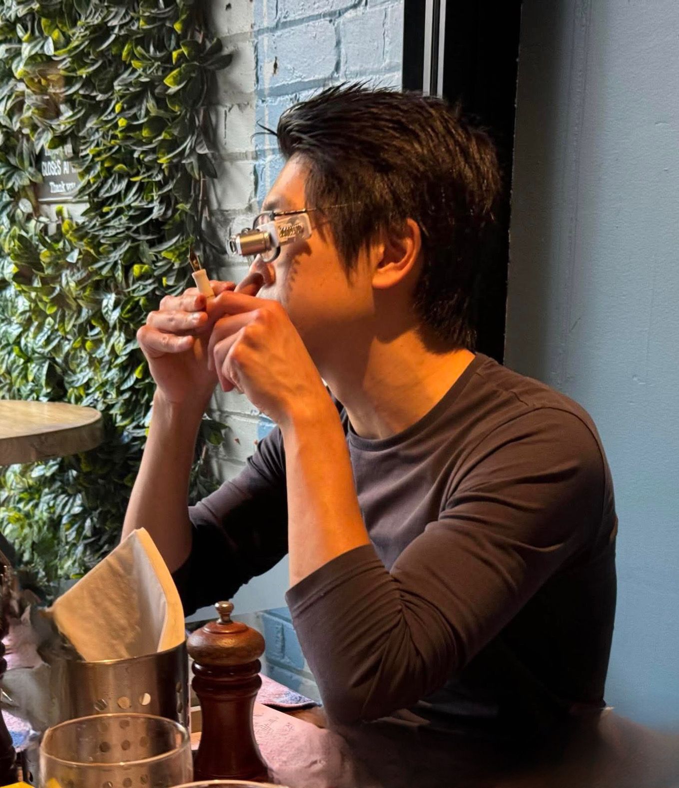 Daniel Zhang inspecting a nib grind