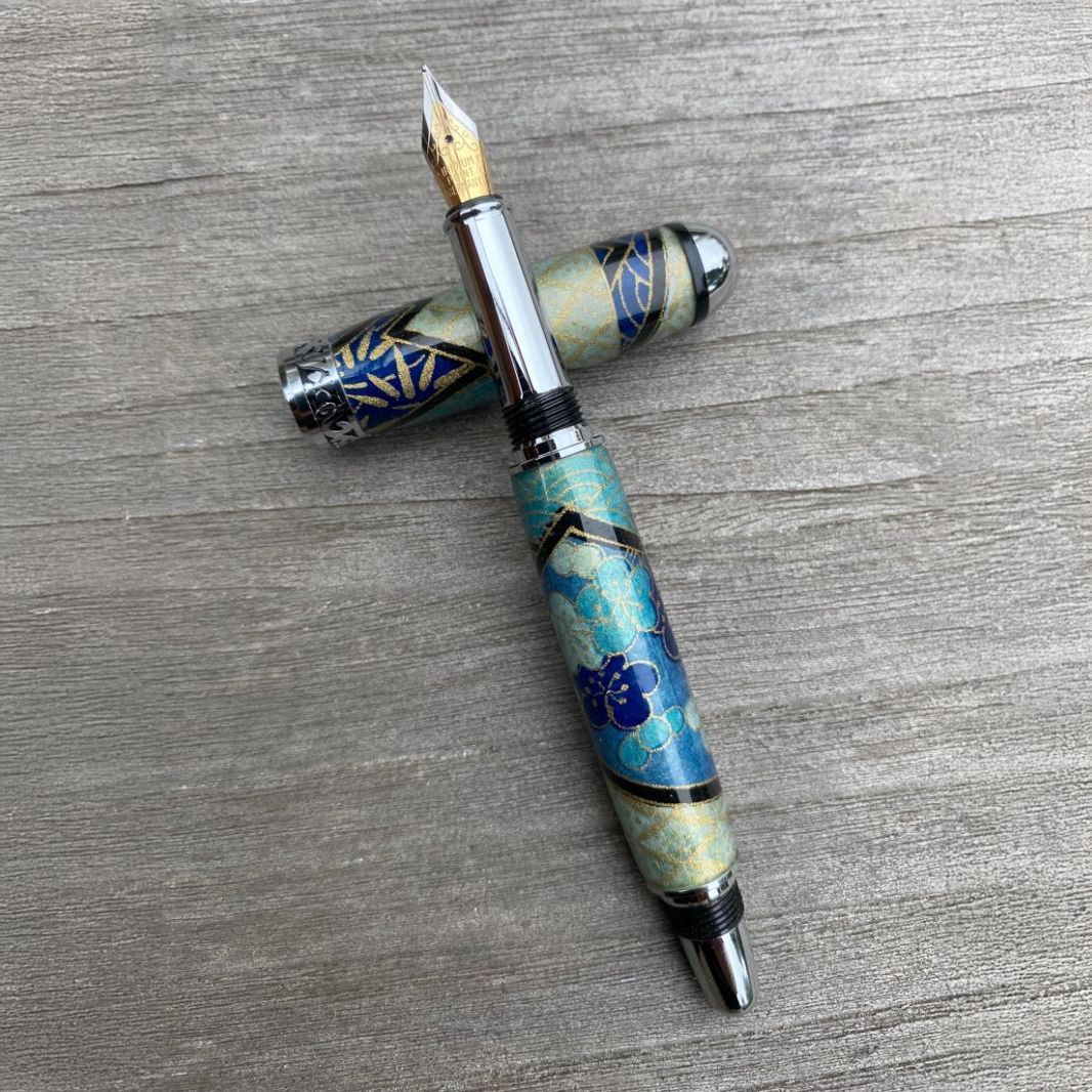 Bespoke fountain pen on weathered wood