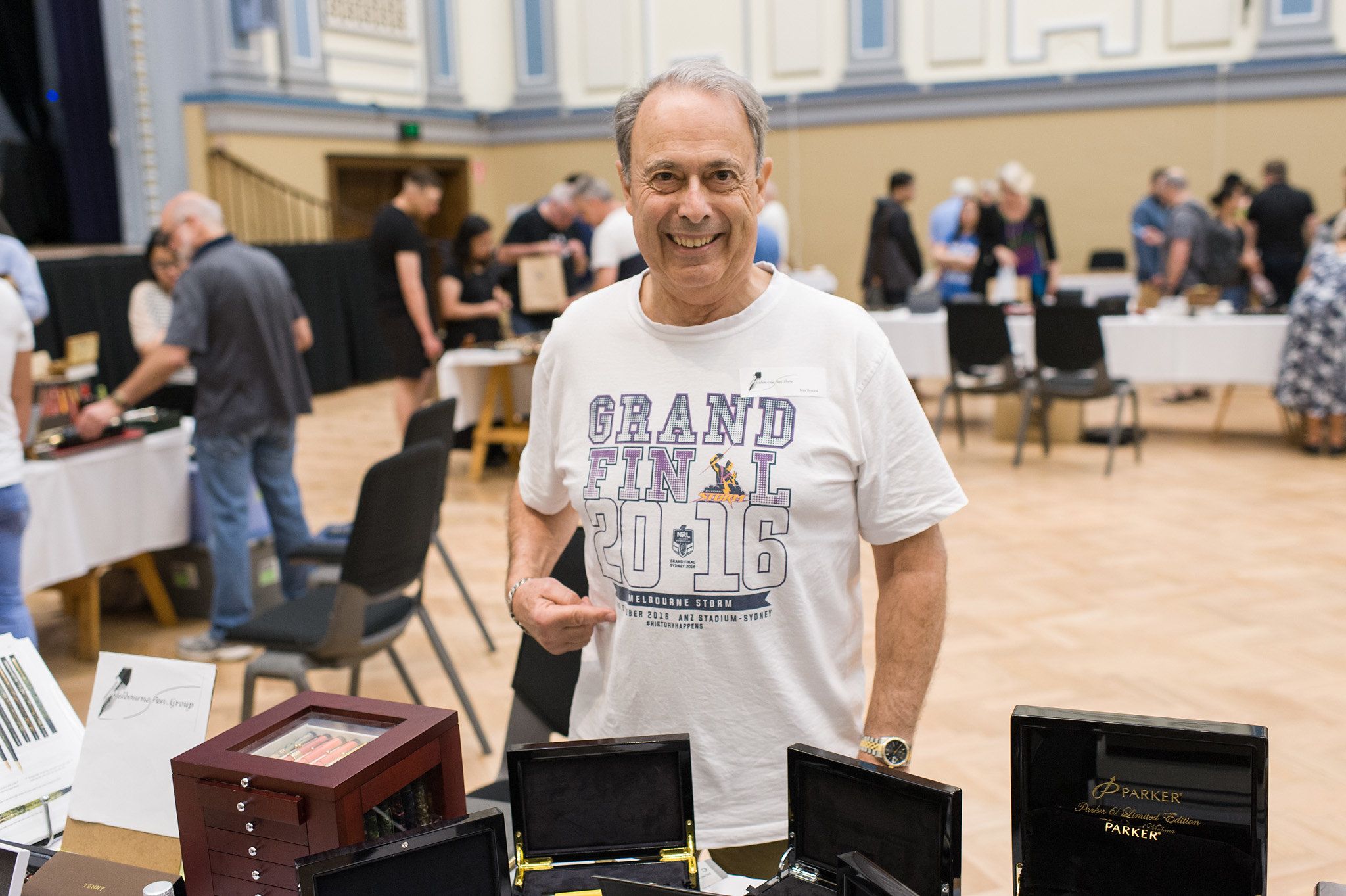 Max braud in front of Melbourne Pen Group table at previous Melbourne Pen Show