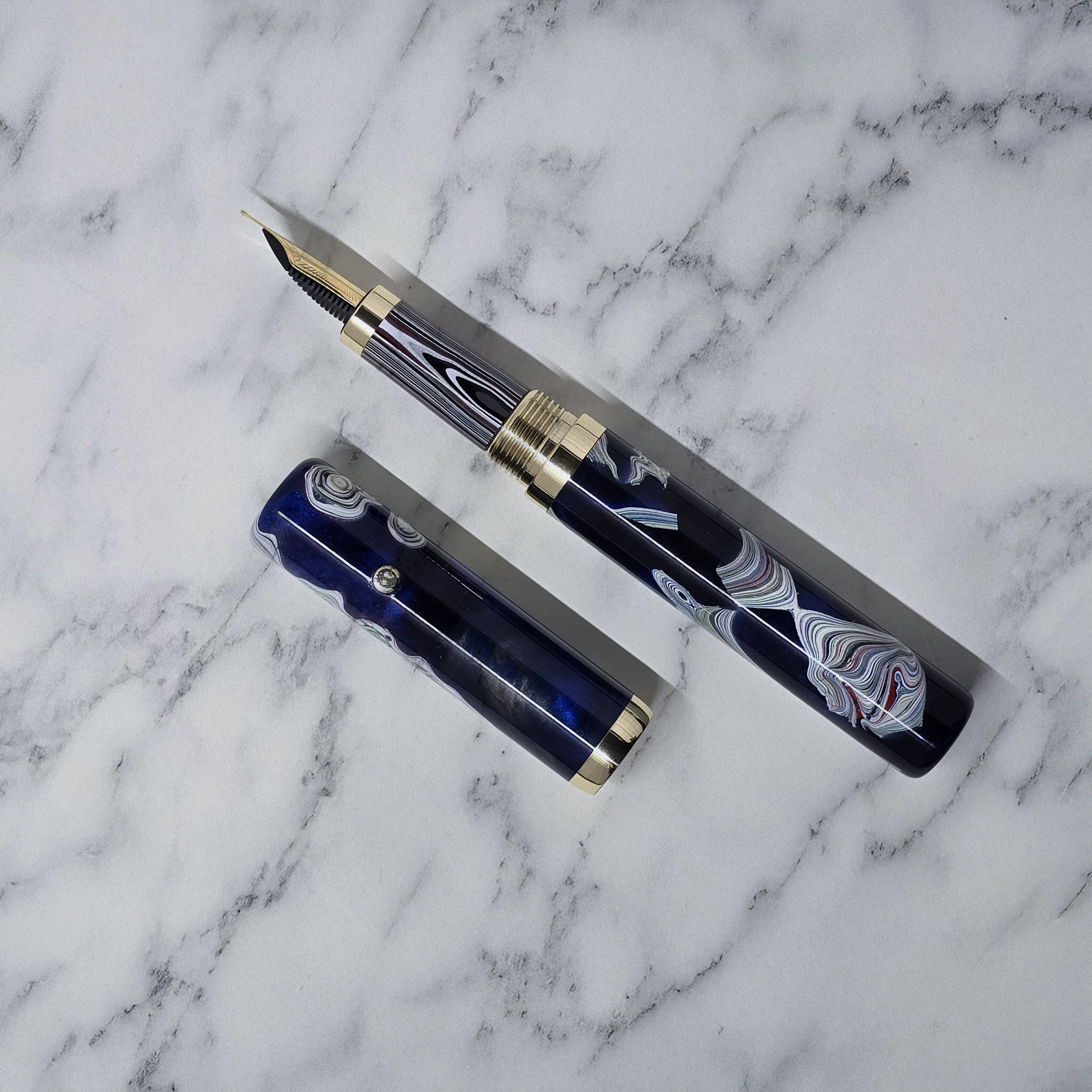Blue and white swirly resin fountain pen