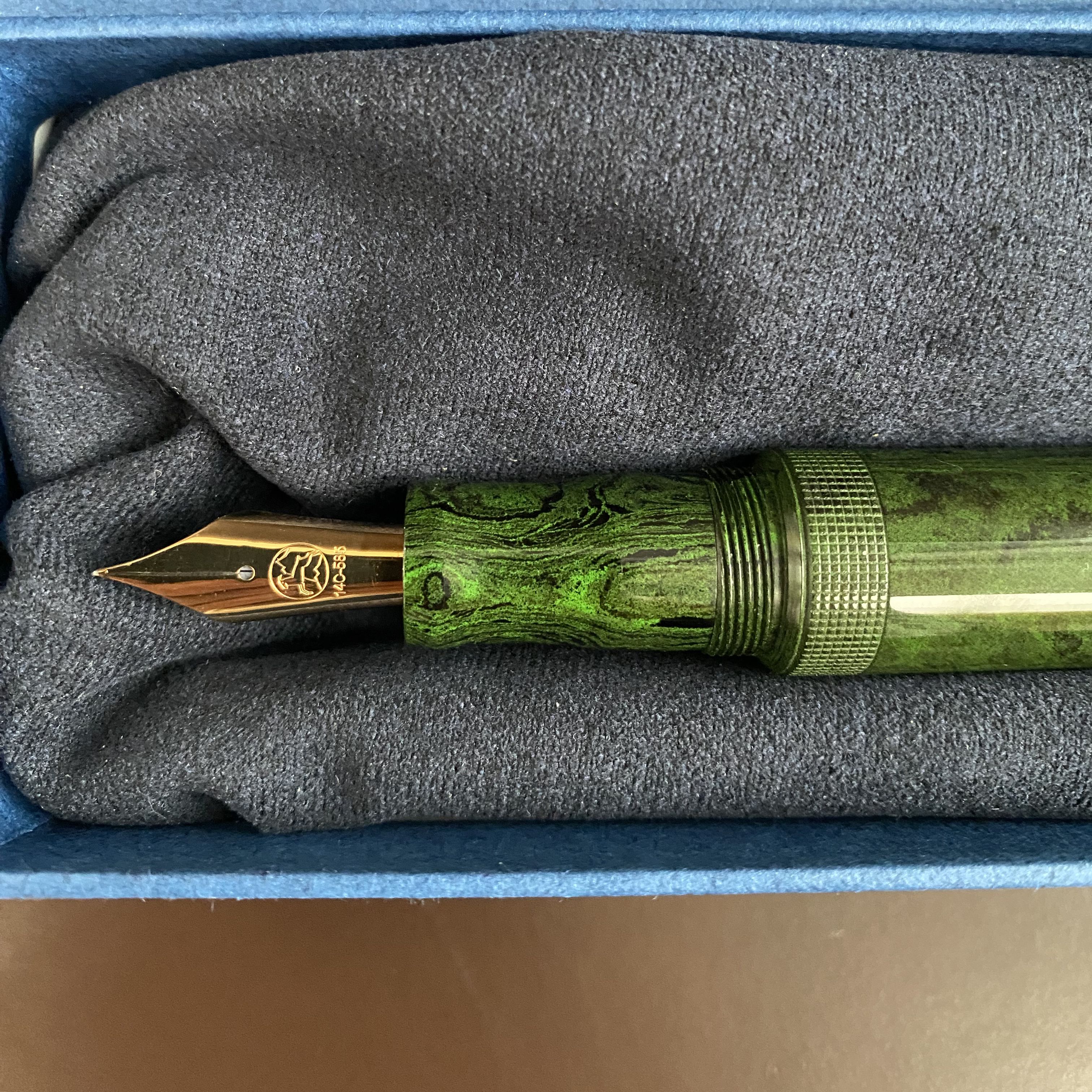 Green mottled Eboya fountain pen closeup of section and nib