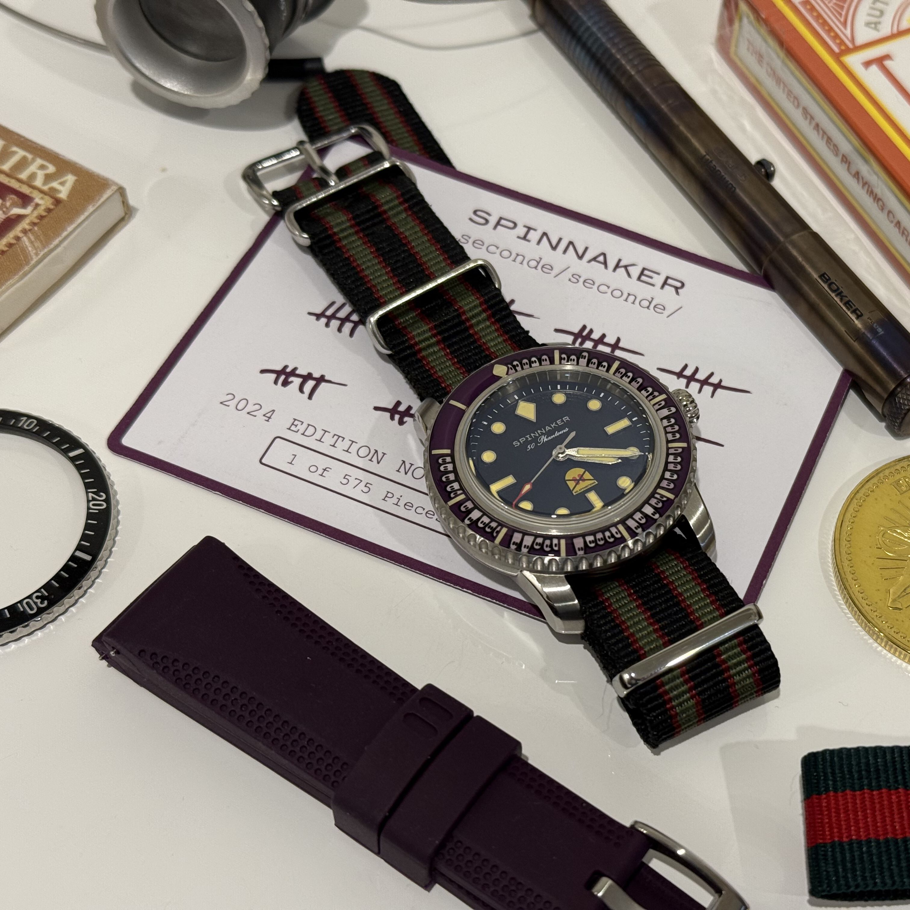 watch, straps, pen, loupe, lense