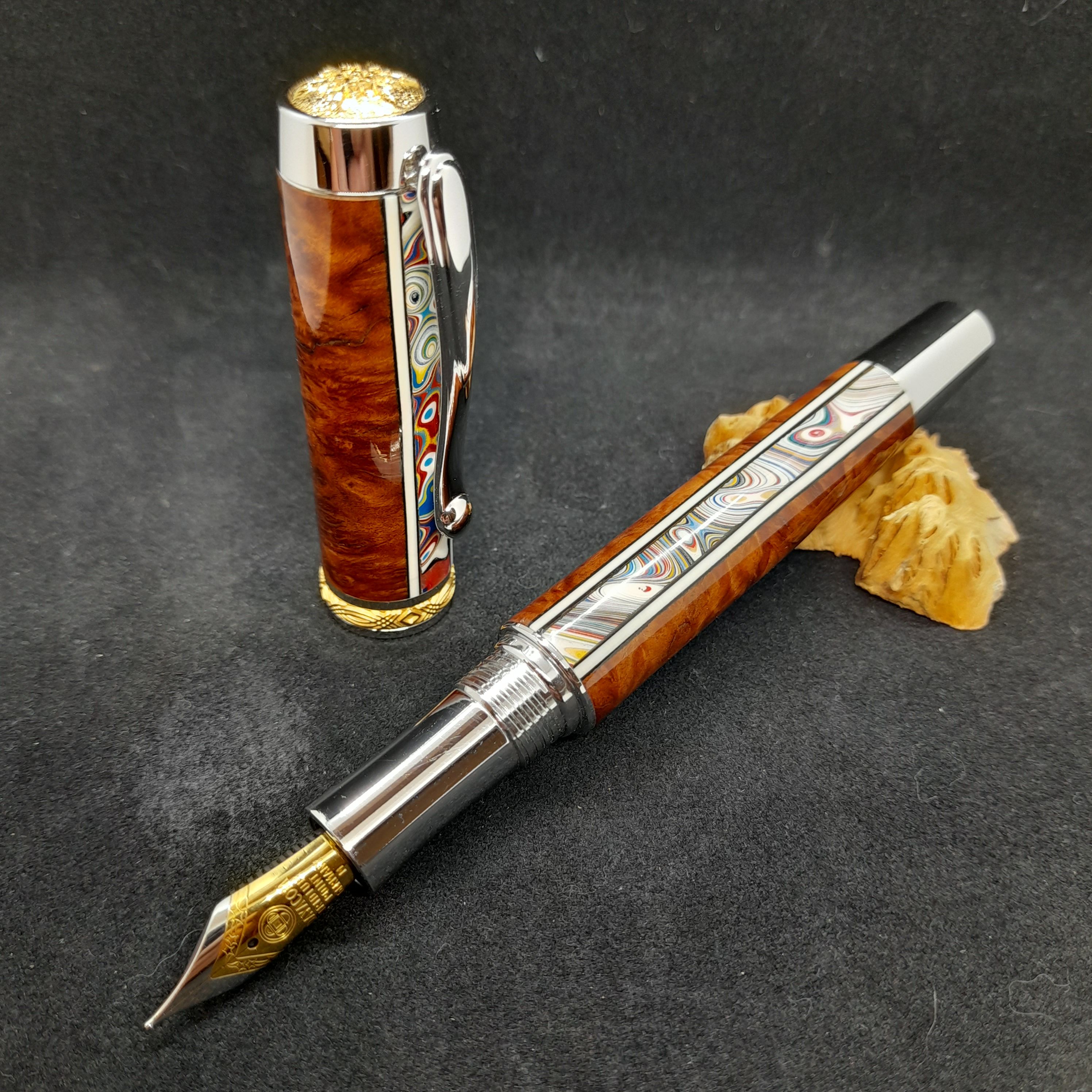 Wood fountain pen with rainbow swirl inlay