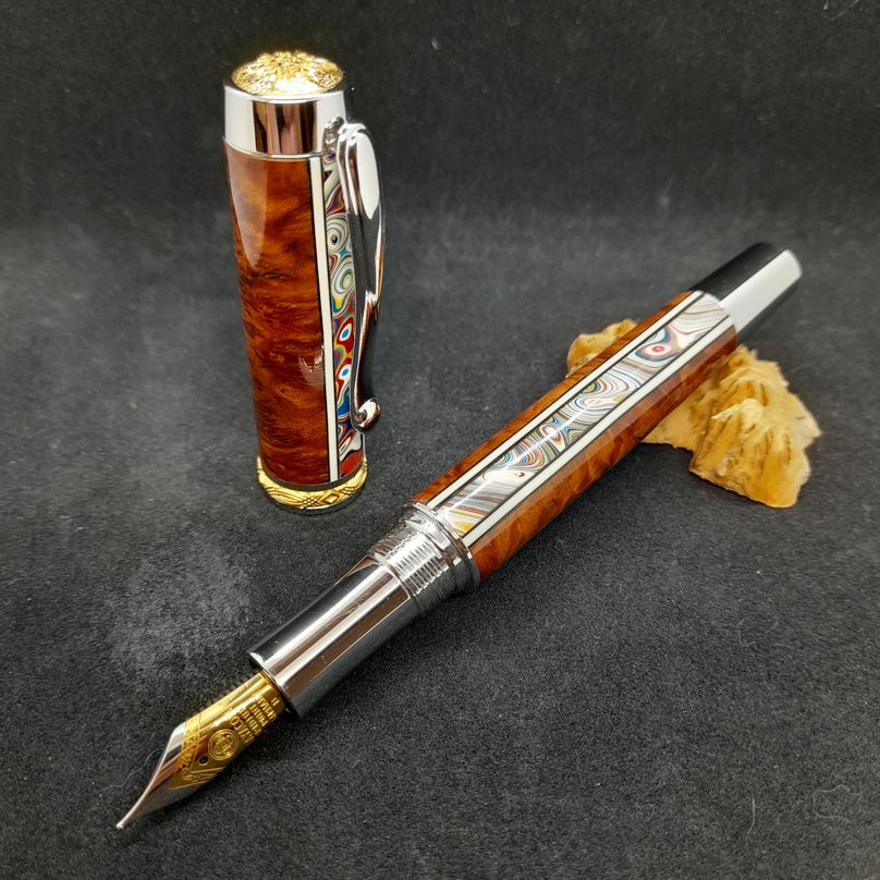 wood and metal fountain pen with rainbow swirl inlay