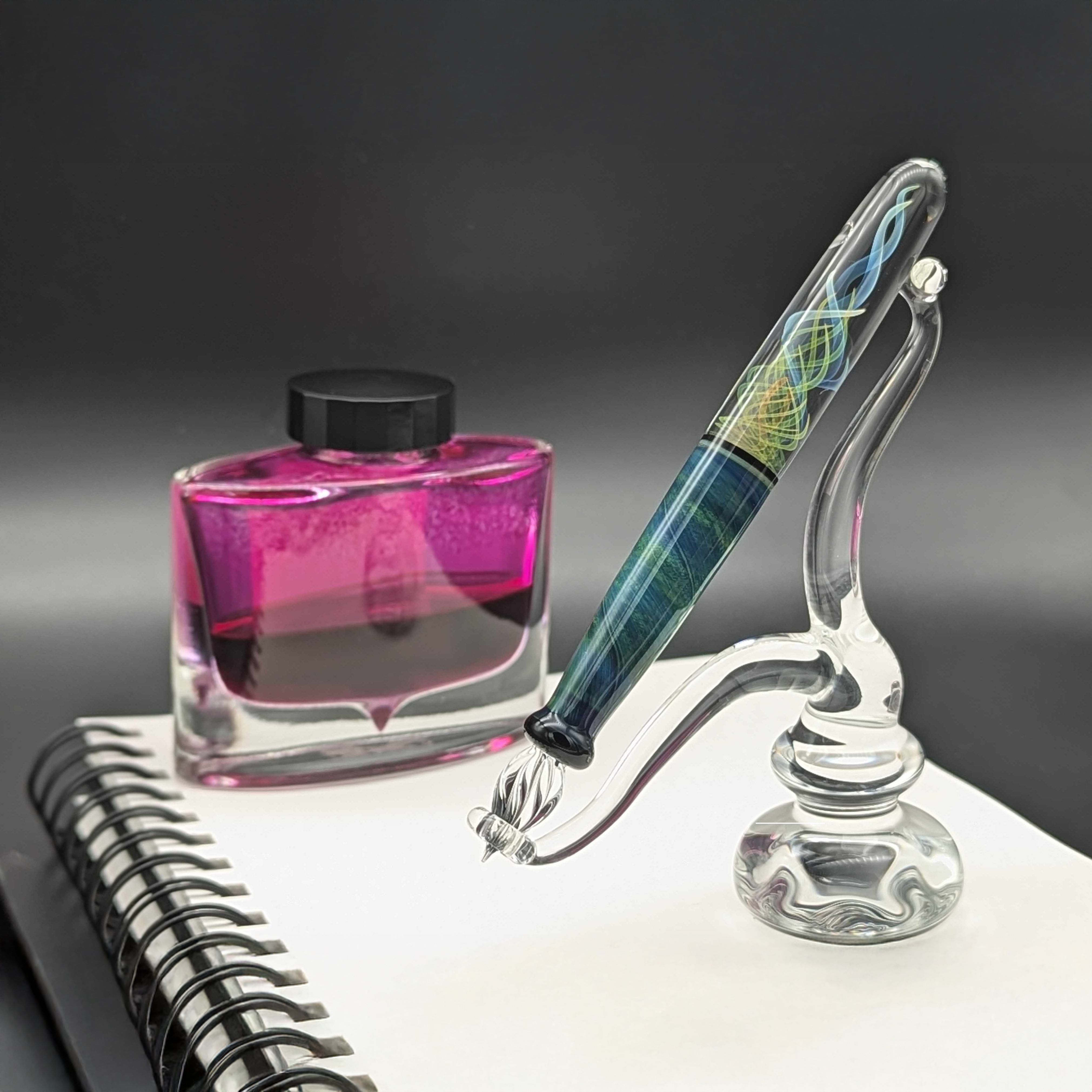 Borosilicate glass dip pen, one half blue/black solid mixed glass, the other half clear with blue and yellow double helix pattern