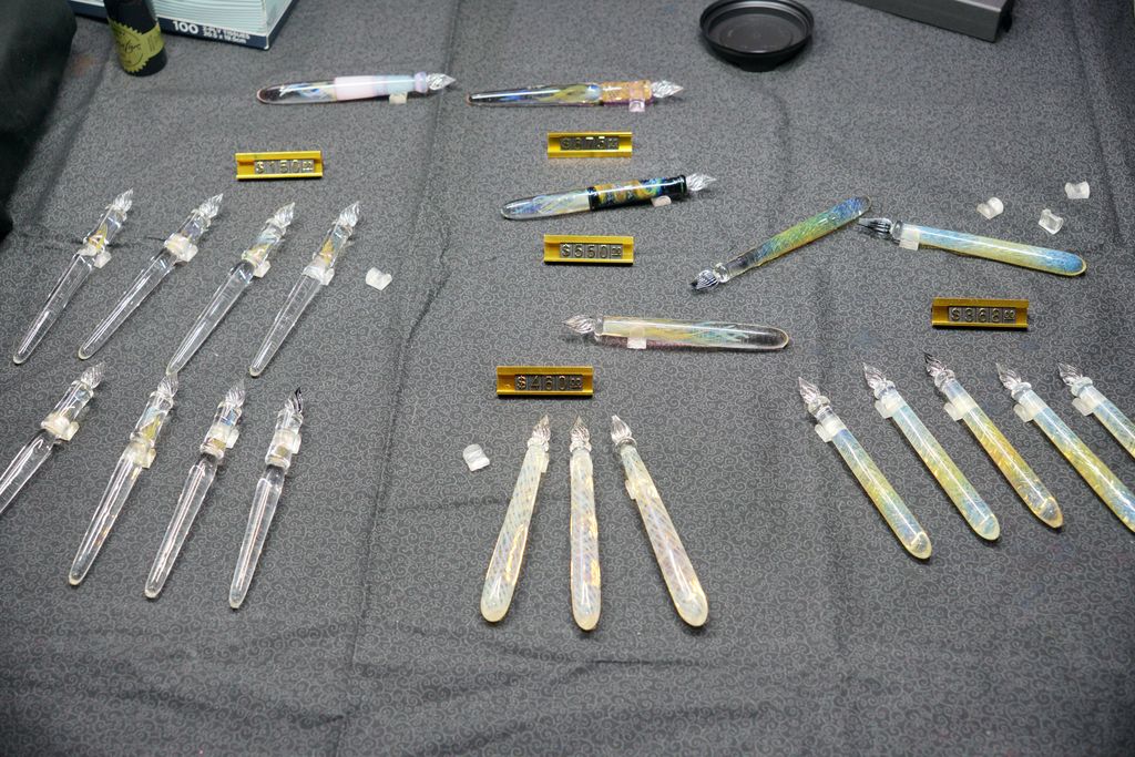 Glass pens arranged on an exhibitor's table