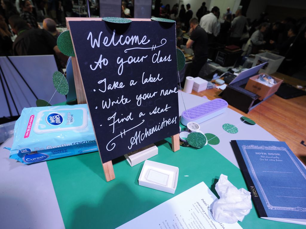 A sign written in white chalk on a small A-frame blackboard: 