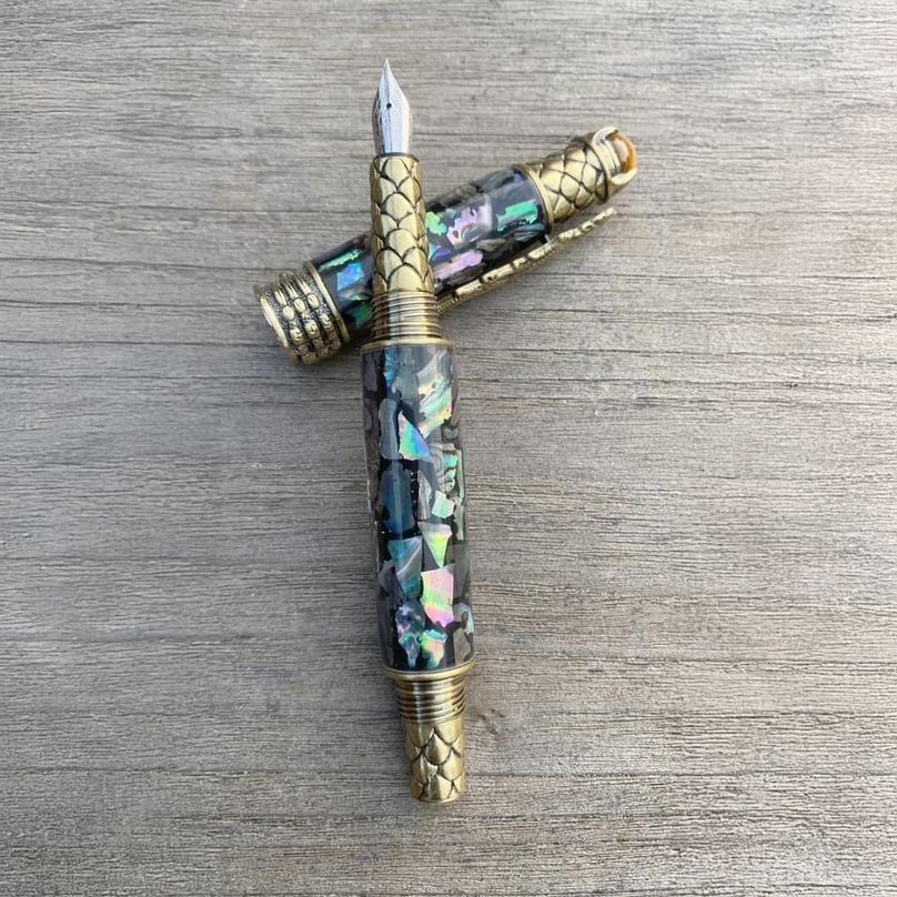 Bespoke fountain pen on weathered wood