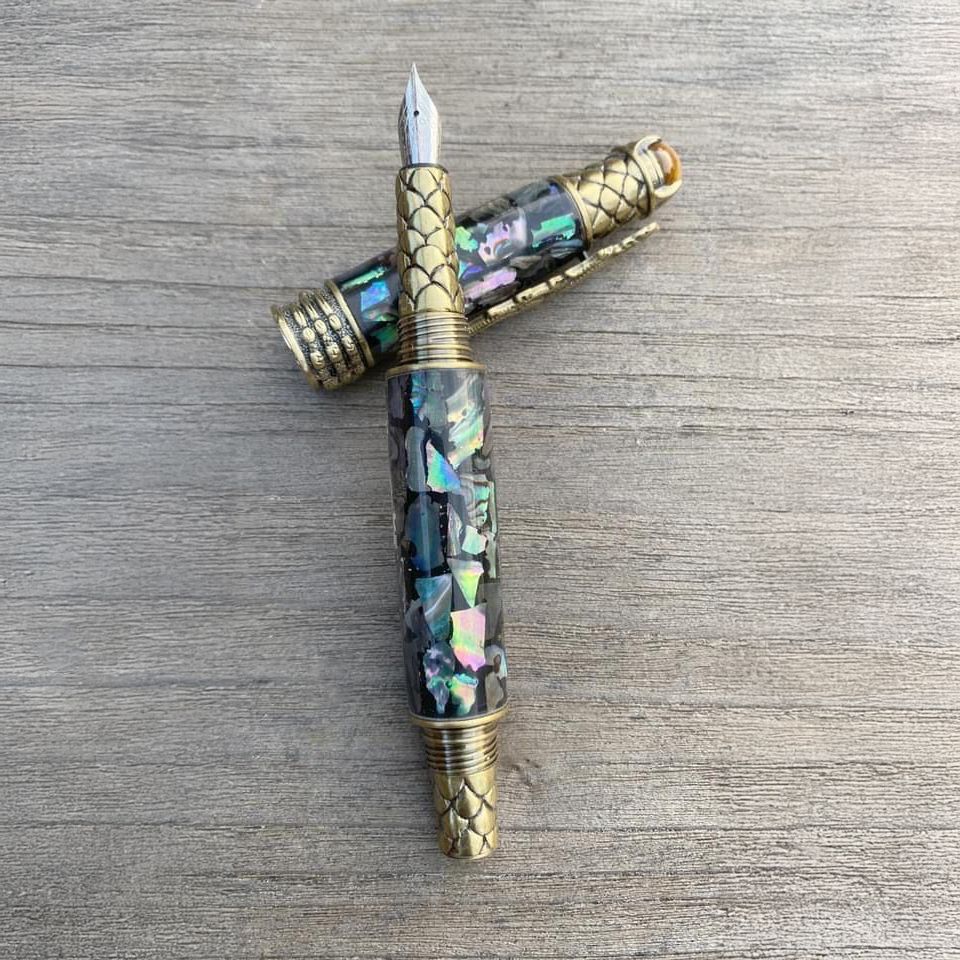 Bespoke fountain pen on weathered wood