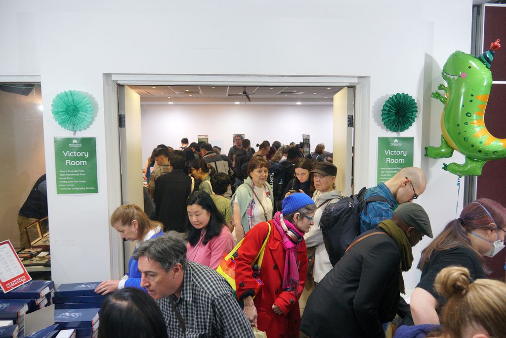 The crowd passing through the entrance to The Victory Room