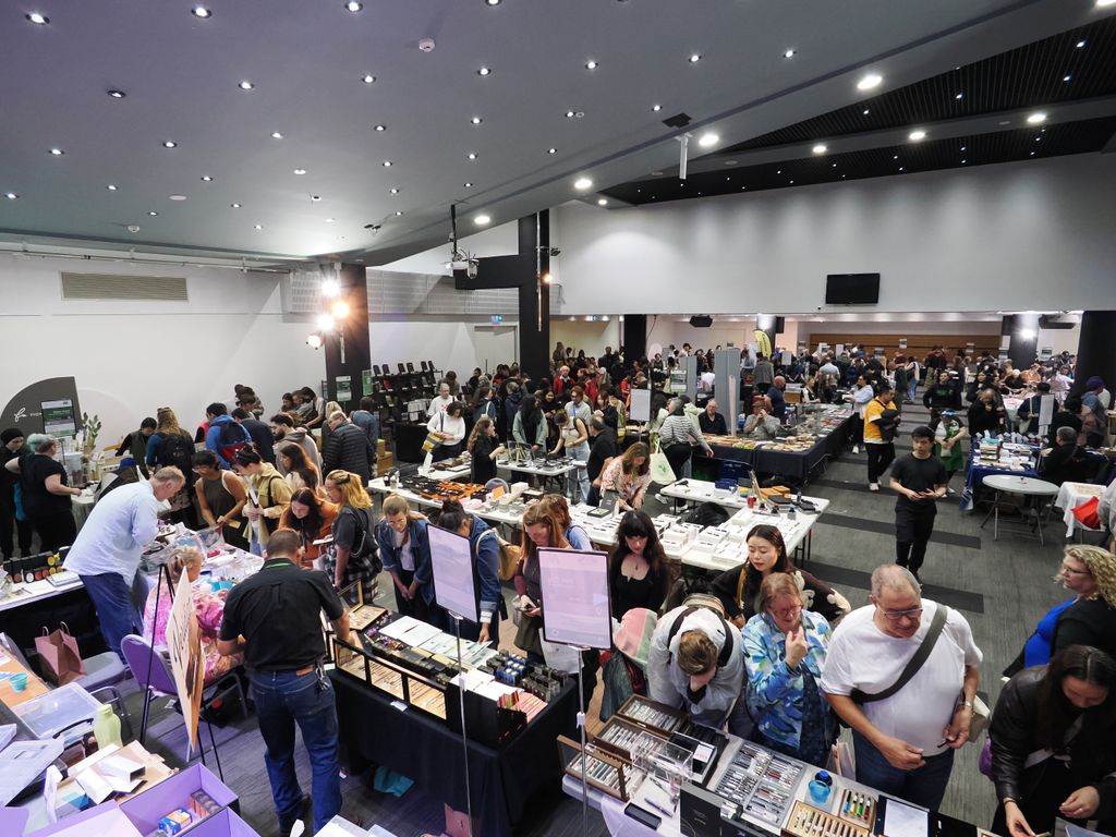A wide view of the busy show floor from above
