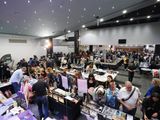 A wide view of the busy show floor from above