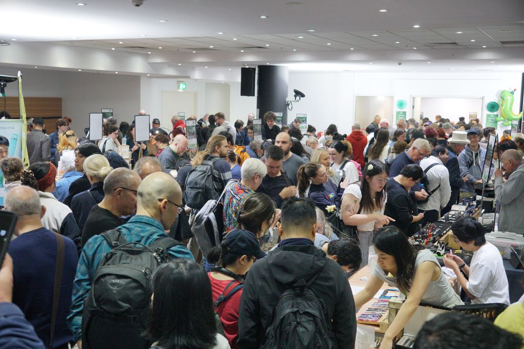 The show floor packed with people