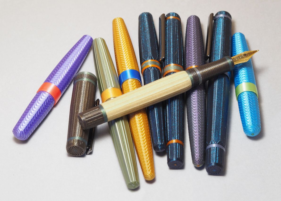 a pile of Platypus Pens in various colours, shapes, patterns and designs