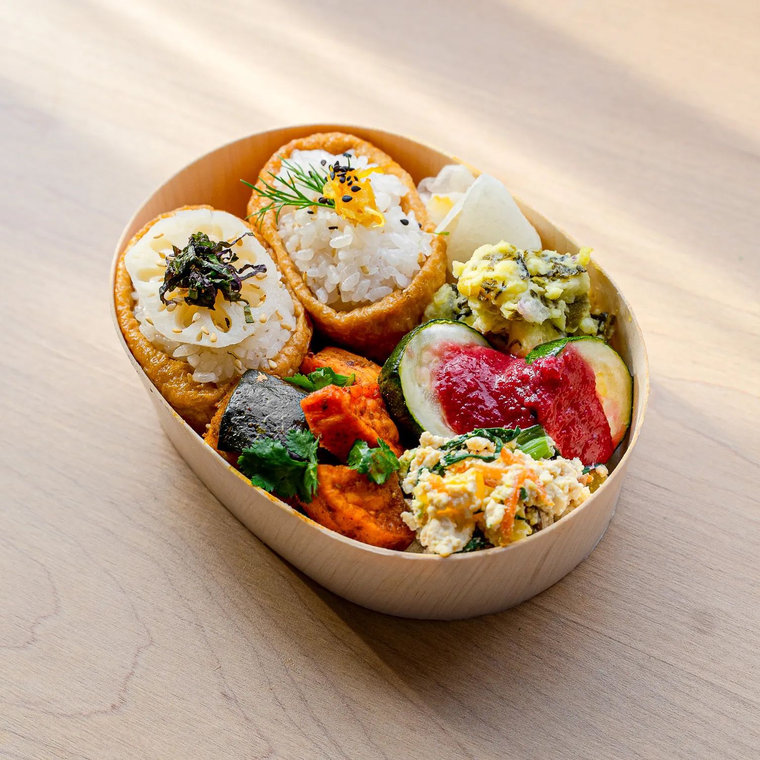 Bento box containing various Japanese food