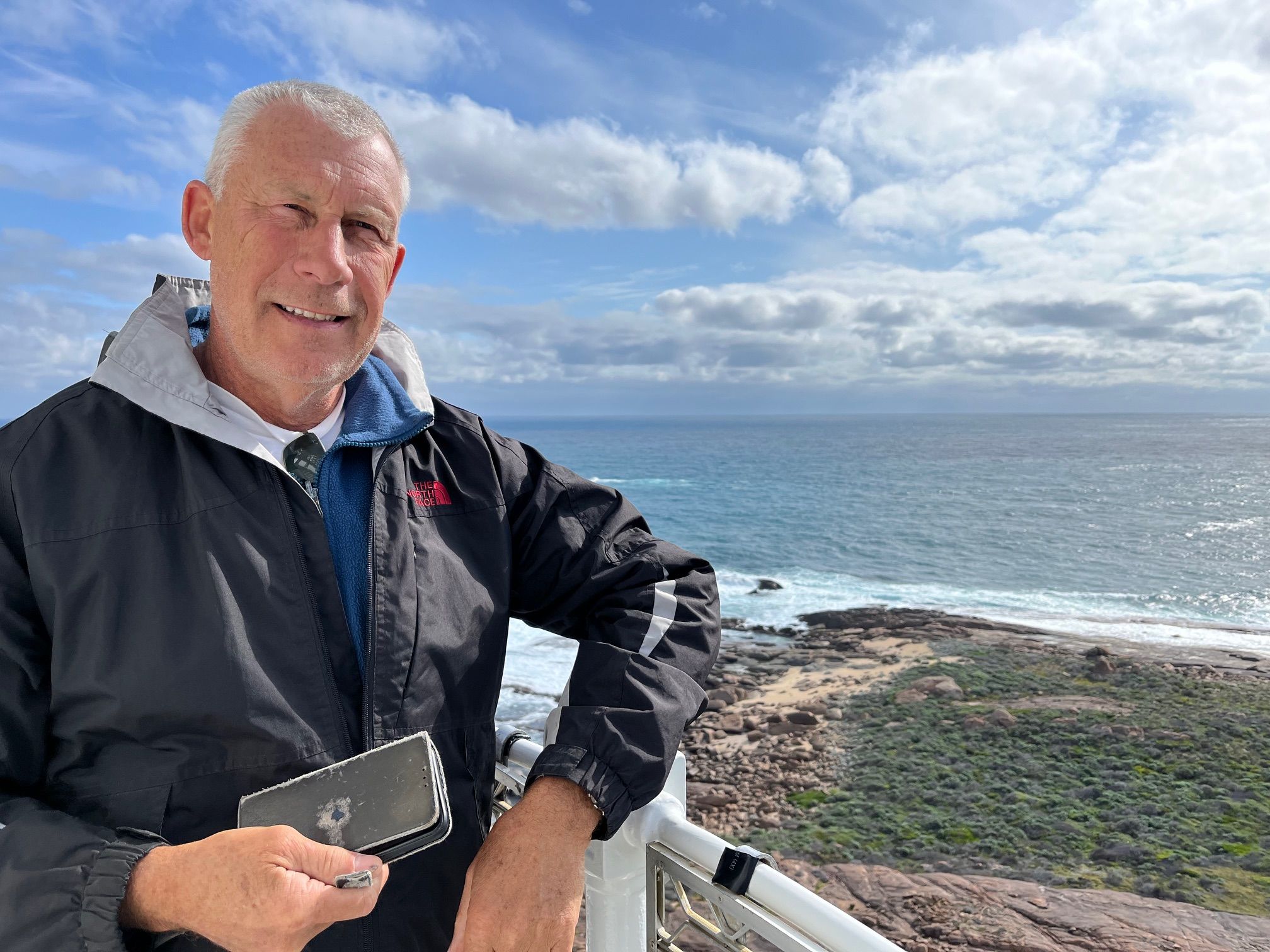 Peter Lucas by the seaside with well used pen case in hand