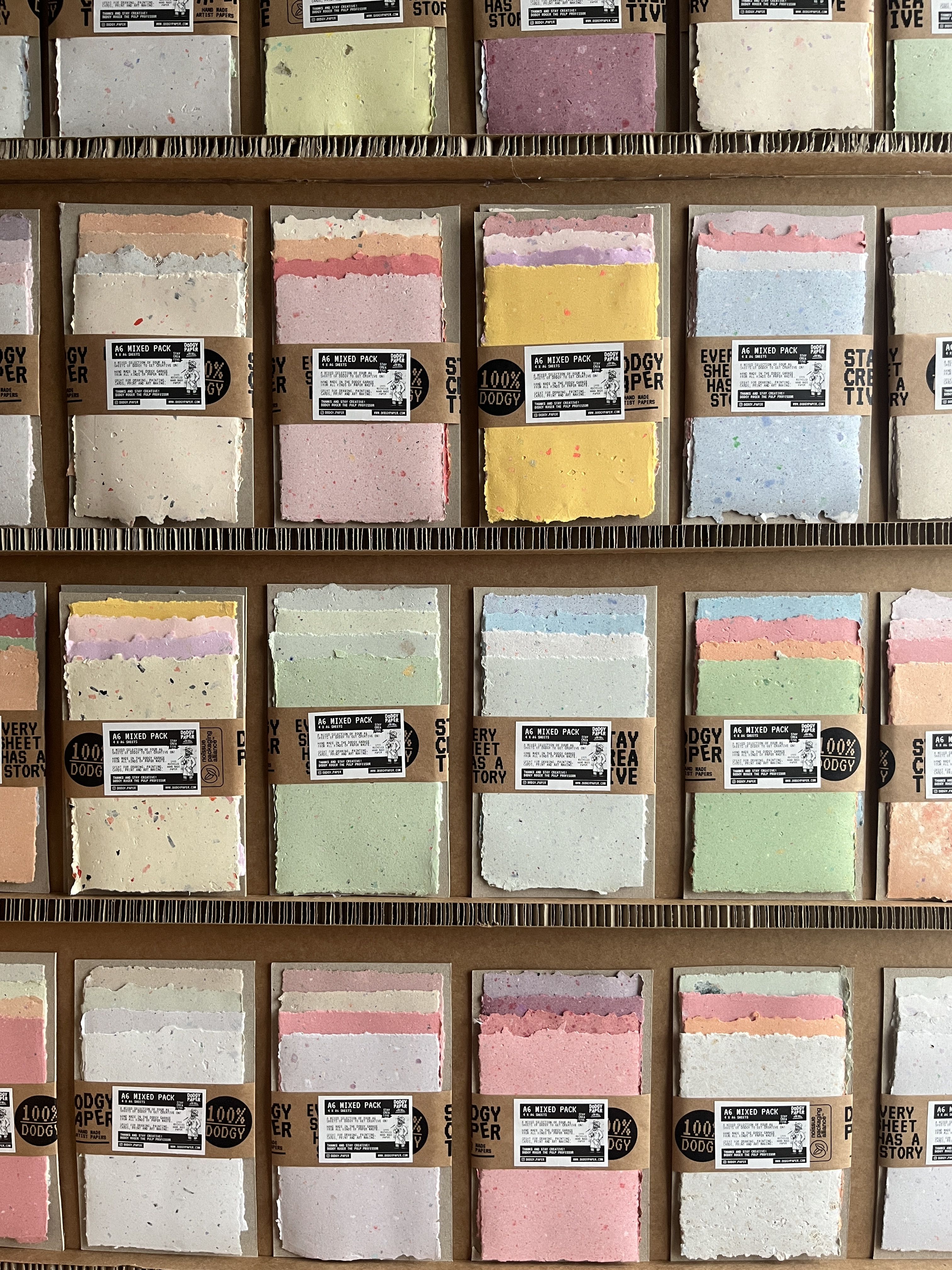 Multicoloured packs of recycled paper