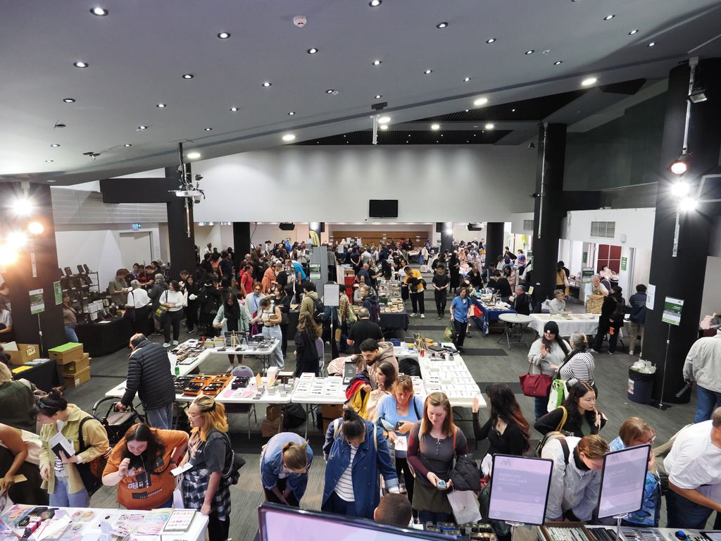 A wide view of the busy show floor from above
